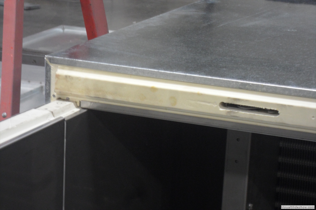 DAT is capable of foam injected insulation.  This picture shows a thermal break foam injected panel with a cam lock mechanism for attaching panels.